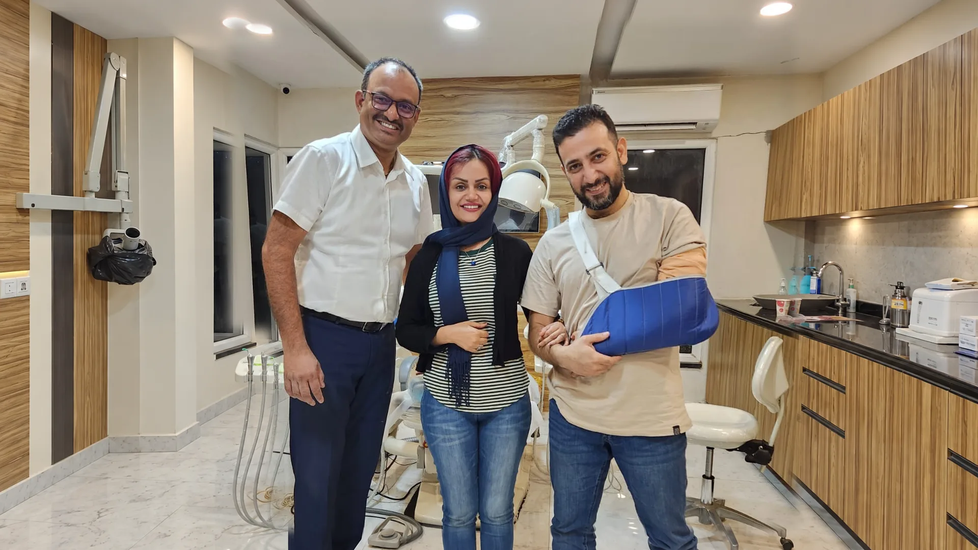 Smiling visitors in the dental treatment room